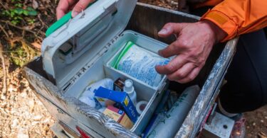 Hiker prepared with safety gear in mountain wilderness