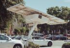 Modern solar-powered charging station for electric vehicles on a sunny day.